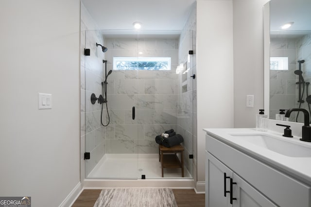 807 Stickley Oak Way, Woodstock, GA 30189 - full bath with vanity, baseboards, wood finished floors, and a shower stall