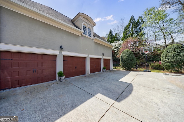 2005 Westbourne Way, Alpharetta, GA 30022 - view of side of home with driveway, stucco siding, a garage, and a shingled roof