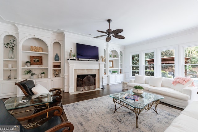 2005 Westbourne Way, Alpharetta, GA 30022 - living area featuring ornamental molding, built in shelves, ceiling fan, dark wood finished floors, and plenty of natural light