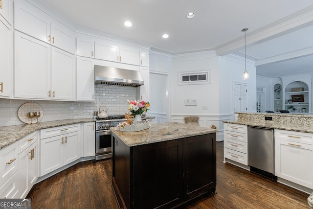 2005 Westbourne Way, Alpharetta, GA 30022 - kitchen with wall chimney range hood, appliances with stainless steel finishes, crown molding, dark wood finished floors, and white cabinets