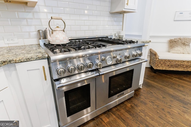 2005 Westbourne Way, Alpharetta, GA 30022 - kitchen view of range with two ovens, tasteful backsplash, light stone counters, and white cabinets