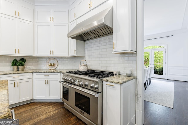 2005 Westbourne Way, Alpharetta, GA 30022 - kitchen with under cabinet range hood, range with two ovens, and white cabinetry