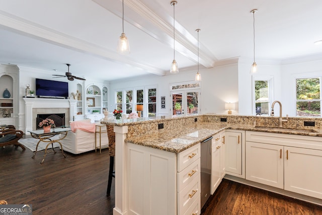 2005 Westbourne Way, Alpharetta, GA 30022 - kitchen featuring a sink, dishwasher, dark wood-style flooring, a ceiling fan, and a kitchen breakfast bar