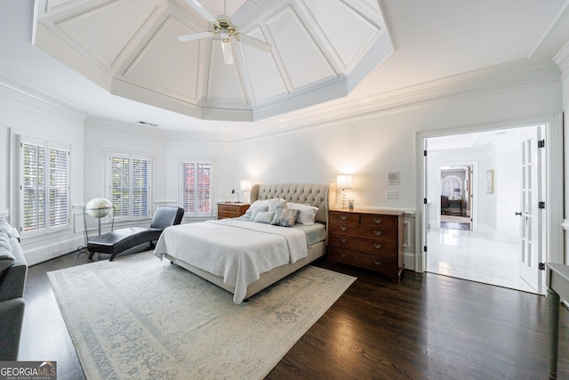 bedroom with crown molding, a ceiling fan, visible vents, and dark wood-type flooring