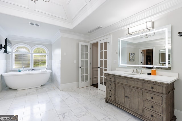 2005 Westbourne Way, Alpharetta, GA 30022 - full bathroom with french doors, a freestanding tub, vanity, a chandelier, and ornamental molding