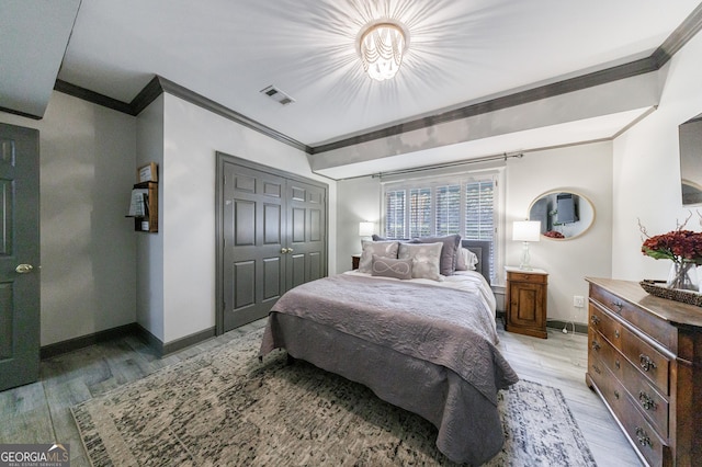 2005 Westbourne Way, Alpharetta, GA 30022 - bedroom featuring crown molding, light wood-style flooring, baseboards, and a closet