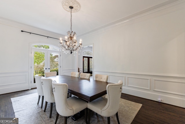 2005 Westbourne Way, Alpharetta, GA 30022 - dining space featuring french doors, a chandelier, crown molding, wood finished floors, and a decorative wall