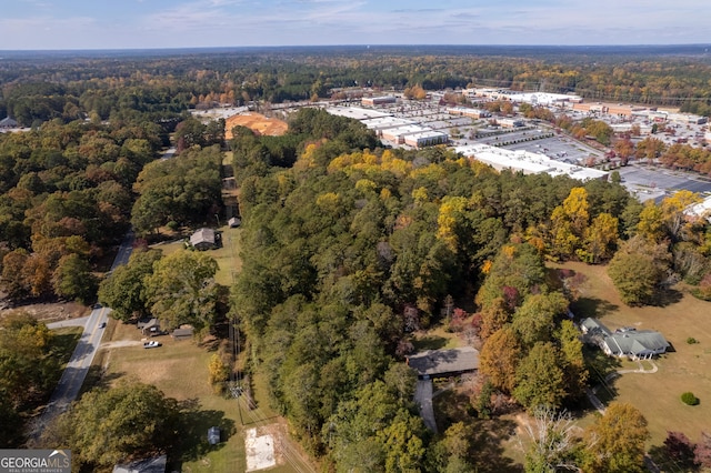 bird's eye view featuring a wooded view