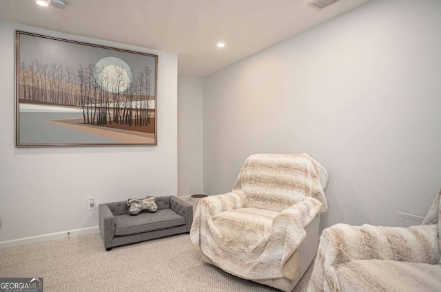 sitting room featuring baseboards, recessed lighting, and carpet