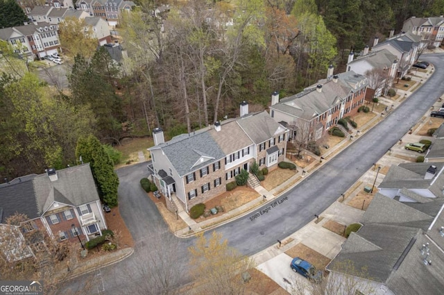 birds eye view of property with a residential view