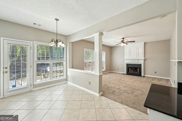 3936 Toccoa Falls Dr, Duluth, GA 30097 - unfurnished living room featuring light carpet, a textured ceiling, a ceiling fan, a fireplace, and baseboards