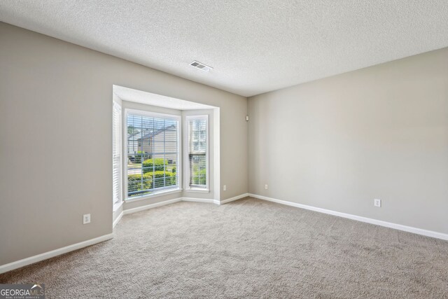 3936 Toccoa Falls Dr, Duluth, GA 30097 - carpeted empty room with a textured ceiling and baseboards