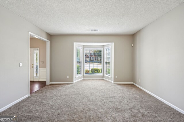 3936 Toccoa Falls Dr, Duluth, GA 30097 - unfurnished room with carpet floors, a textured ceiling, and baseboards