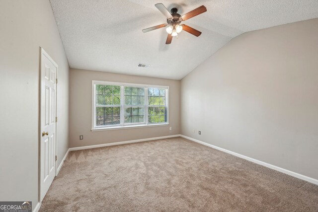 3936 Toccoa Falls Dr, Duluth, GA 30097 - unfurnished room featuring carpet flooring, a textured ceiling, ceiling fan, vaulted ceiling, and baseboards