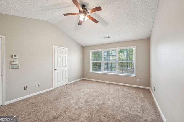 3936 Toccoa Falls Dr, Duluth, GA 30097 - unfurnished bedroom with a textured ceiling, carpet floors, vaulted ceiling, baseboards, and a ceiling fan