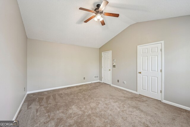 3936 Toccoa Falls Dr, Duluth, GA 30097 - empty room featuring a ceiling fan, vaulted ceiling, carpet floors, and baseboards