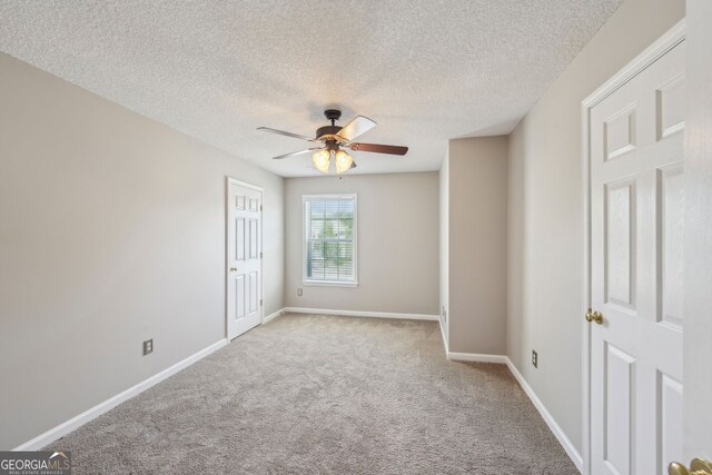 3936 Toccoa Falls Dr, Duluth, GA 30097 - carpeted empty room with ceiling fan, baseboards, and a textured ceiling