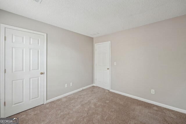 3936 Toccoa Falls Dr, Duluth, GA 30097 - spare room with carpet floors, a textured ceiling, and baseboards
