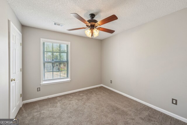 3936 Toccoa Falls Dr, Duluth, GA 30097 - unfurnished bedroom featuring carpet, baseboards, a textured ceiling, and ceiling fan