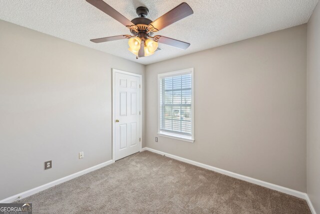 3936 Toccoa Falls Dr, Duluth, GA 30097 - carpeted empty room with baseboards, ceiling fan, and a textured ceiling