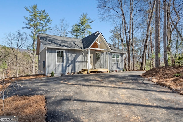 167 Travelers Ln, Clayton, GA 30525 - view of front of house featuring driveway, board and batten siding, and a shingled roof