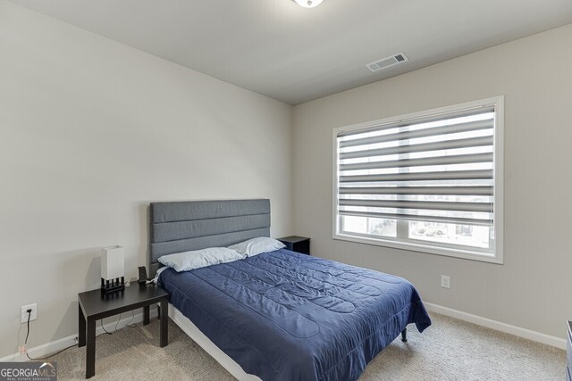 bedroom featuring carpet, baseboards, and visible vents