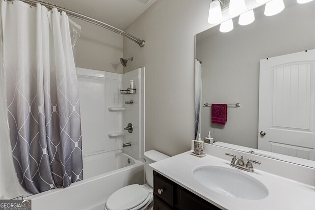 bathroom with shower / bath combination with curtain, toilet, and vanity