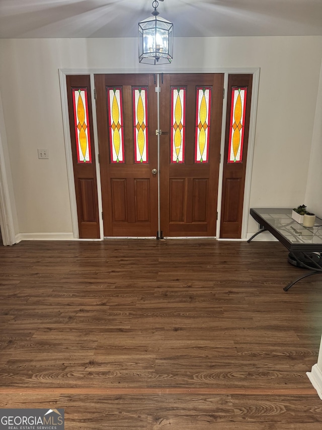 2791 Biscayne Dr, Conyers, GA 30012 - foyer featuring baseboards, wood finished floors, and an inviting chandelier