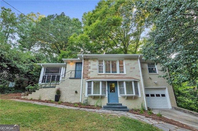 656 Channing Dr NW, Atlanta, GA 30318 - view of front of property with a garage, a front lawn, concrete driveway, and stairway