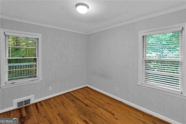 656 Channing Dr NW, Atlanta, GA 30318 - spare room featuring wood finished floors and crown molding
