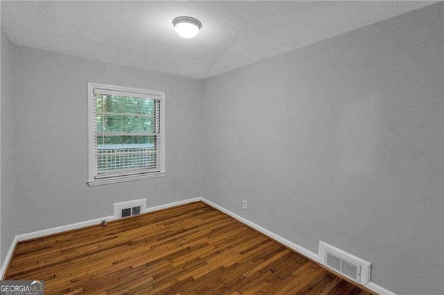 656 Channing Dr NW, Atlanta, GA 30318 - empty room featuring wood finished floors and baseboards