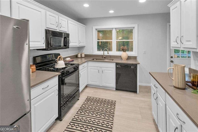 656 Channing Dr NW, Atlanta, GA 30318 - kitchen featuring black appliances, white cabinets, and recessed lighting