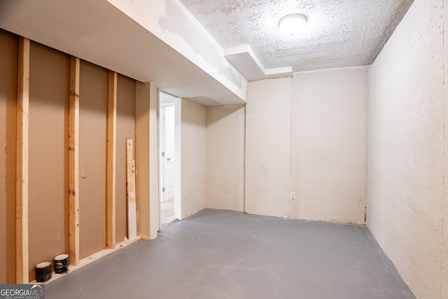 below grade area featuring a textured ceiling