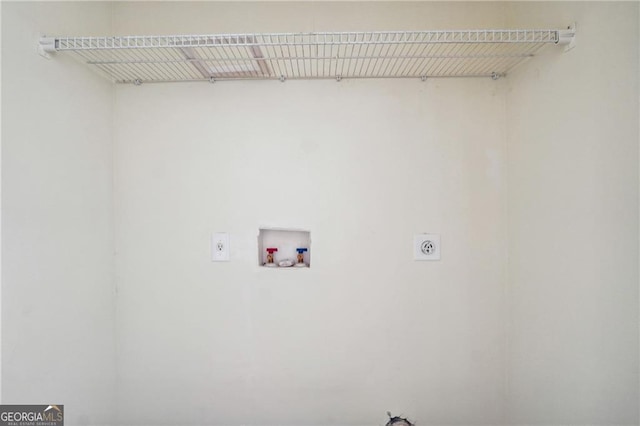 washroom featuring hookup for a washing machine, hookup for an electric dryer, and laundry area