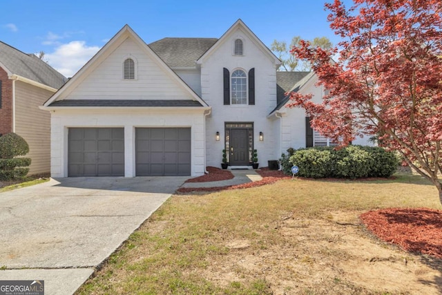 view of front facade with a garage, brick siding, a front lawn, driveway, and a shingled roof