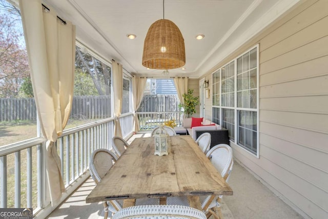 sunroom with outdoor dining space