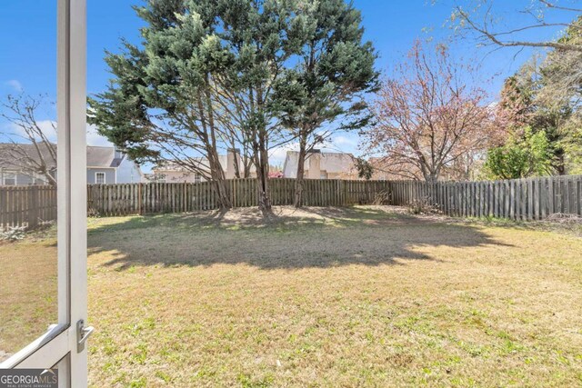 view of yard featuring a fenced backyard