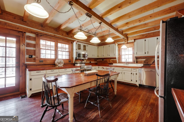 1621 Daniells Bridge Rd, Athens, GA 30606 - dining space featuring dark wood-style floors and beam ceiling