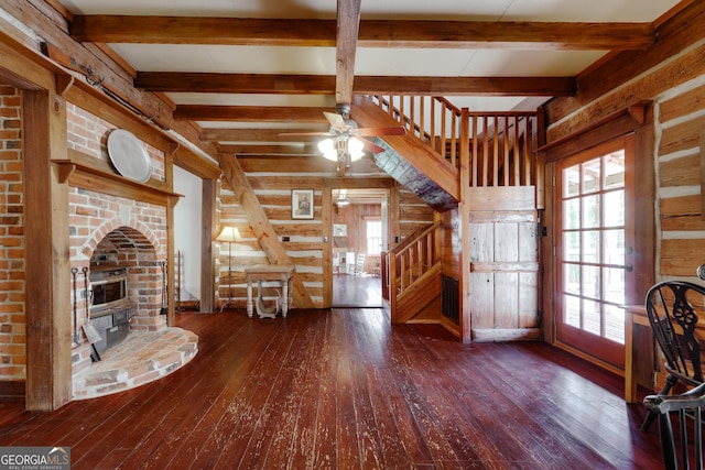 1621 Daniells Bridge Rd, Athens, GA 30606 - unfurnished living room featuring hardwood / wood-style floors, healthy amount of natural light, stairway, a ceiling fan, and beam ceiling