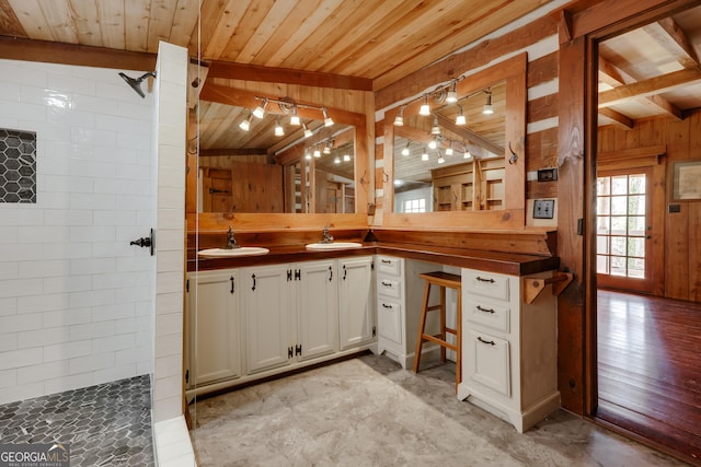 1621 Daniells Bridge Rd, Athens, GA 30606 - kitchen with a sink, wood walls, wooden ceiling, and white cabinets