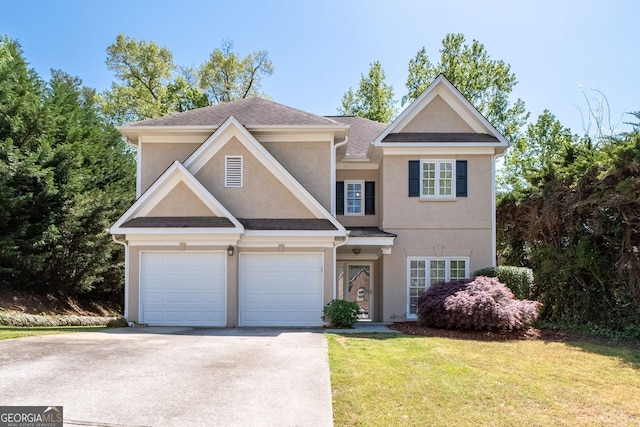 view of front of property with a garage, a front lawn, driveway, and stucco siding