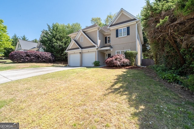 view of front facade with an attached garage, concrete driveway, a front lawn, and stucco siding