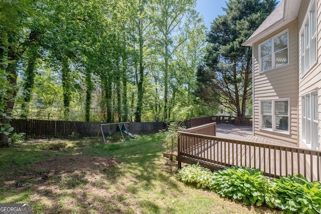 view of yard with a fenced backyard and a wooden deck