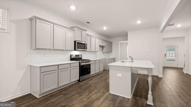1099 Blue Juniper Cir, Loganville, GA 30052 - kitchen with a kitchen island with sink, gray cabinetry, appliances with stainless steel finishes, and dark wood-style floors