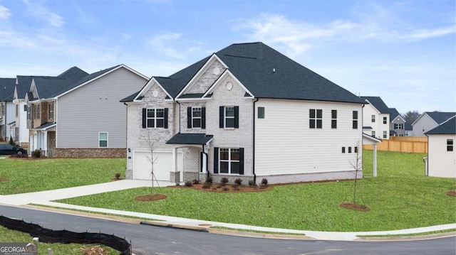 1099 Blue Juniper Cir, Loganville, GA 30052 - view of front of house with a residential view, a front yard, driveway, and a garage