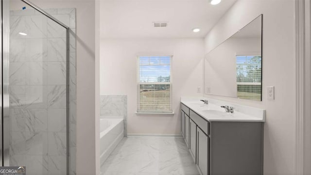 1099 Blue Juniper Cir, Loganville, GA 30052 - bathroom with a marble finish shower, a bath, marble finish floor, baseboards, and visible vents