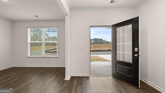 1099 Blue Juniper Cir, Loganville, GA 30052 - foyer entrance featuring baseboards, dark wood-style flooring, and visible vents