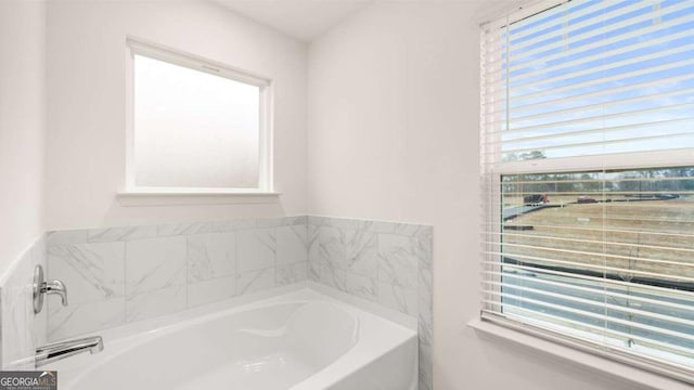 1099 Blue Juniper Cir, Loganville, GA 30052 - bathroom with a garden tub