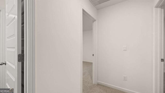 1099 Blue Juniper Cir, Loganville, GA 30052 - hall featuring carpet floors, baseboards, and visible vents