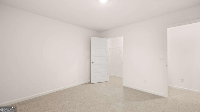 1099 Blue Juniper Cir, Loganville, GA 30052 - empty room featuring baseboards and light colored carpet